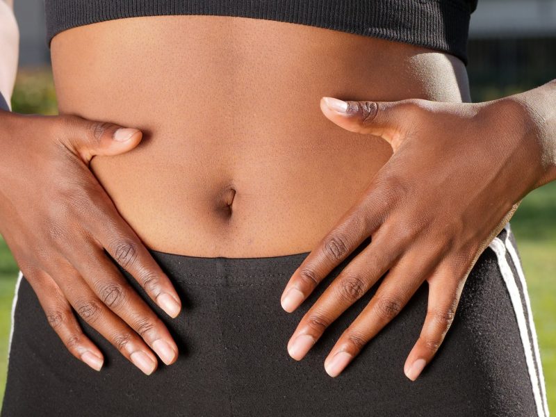 a person touching her belly